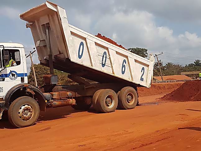 Work in Progress.  Personnel of Mothercat Limited working on the dualization and  construction of additional carriageway on the Lokoja-Benin Road (Section II: Okene-Auchi, 26.70km) running through Kogi and Edo States and also entails the construction of a new two lane travel way of 63. 7Km length running side by side the existing road as part of the on going expansion and rehabilitation of roads across the country by the Federal Ministry of Power, Works and Housing under the 2016 Budget