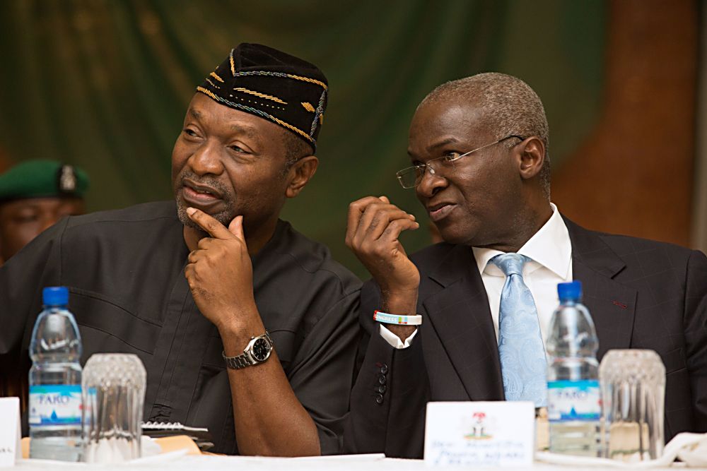 Hon. Minister of Power, Works & Housing, Mr Babatunde Fashola,SAN(right) and Minister of Budget & National Planning, Senator Udoma Udoma (left) during the 2nd Presidential Quarterly Business Forum at the State House Banquet Hall, Abuja on Monday 23rd, January 2017