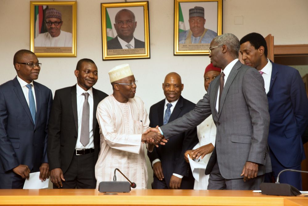 Minister of Power, Works & Housing, Mr Babatunde Fashola, SAN (2nd right),Vice Chairman and  Commissioner representing North West, Engr.Sanusi Garba (3rd left); Commissioner representing South West, Dr Musiliu Oseni(left), Commissioner representing North East,Mr Nathan Shatti(2nd left); Commissioner representing South East, Prof. Frank Okafor(middle) and Commissioner representing North Central, Dr Moses Arigu(3rd left) during the inauguration of the Vice Chairman and Commissioners of the Nigerian Electricity Regulatory Commisssion (NERC) at the Ministry of Power, Works & Housing Headquarters, Mabushi onTuesday 7th,  February 2017