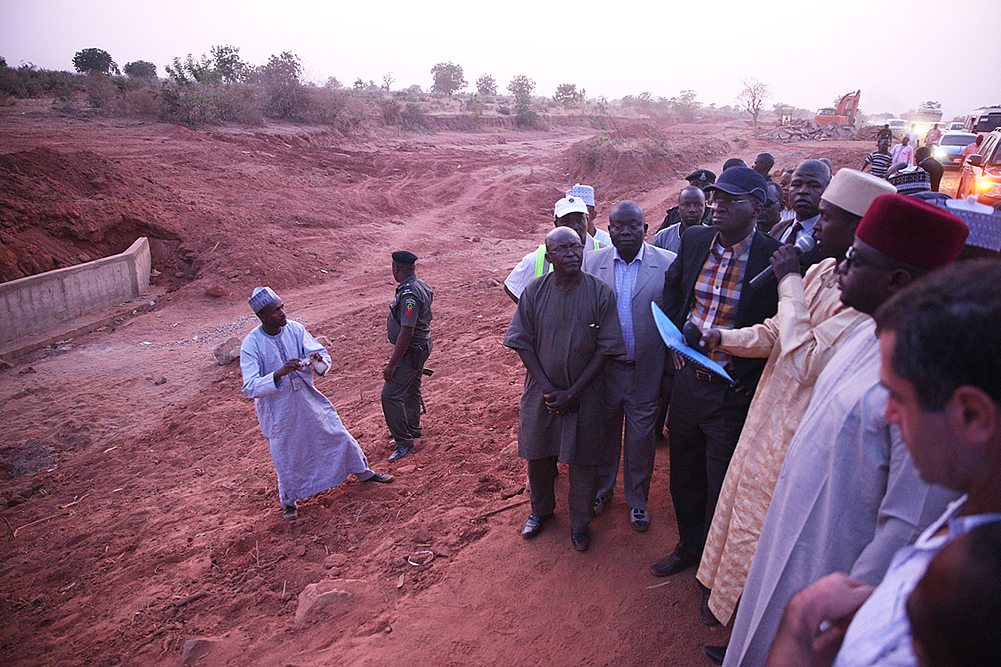 Hon Minister of Power Works  Housing Mr Babatunde FasholaSANright with Director HighwaysNorth East Engr Rufai Mohammed 2nd leftFederal Controller of Works Bauchi State EngrCharles Ezike left being briefed by the Federal Controller of Works Gombe State Engr Rugba Emenoge middle and others during the Hon Ministers inspection tour of the ongoing work on the Emergency Reinstatement of failed Section of Road between KM 33  800 and KM 37 700 on Gombe Bauchi Road Gombe State on the first day of his inspection tour of Highway Projects in the North East Zone of the country on Thursday 16 March  2017