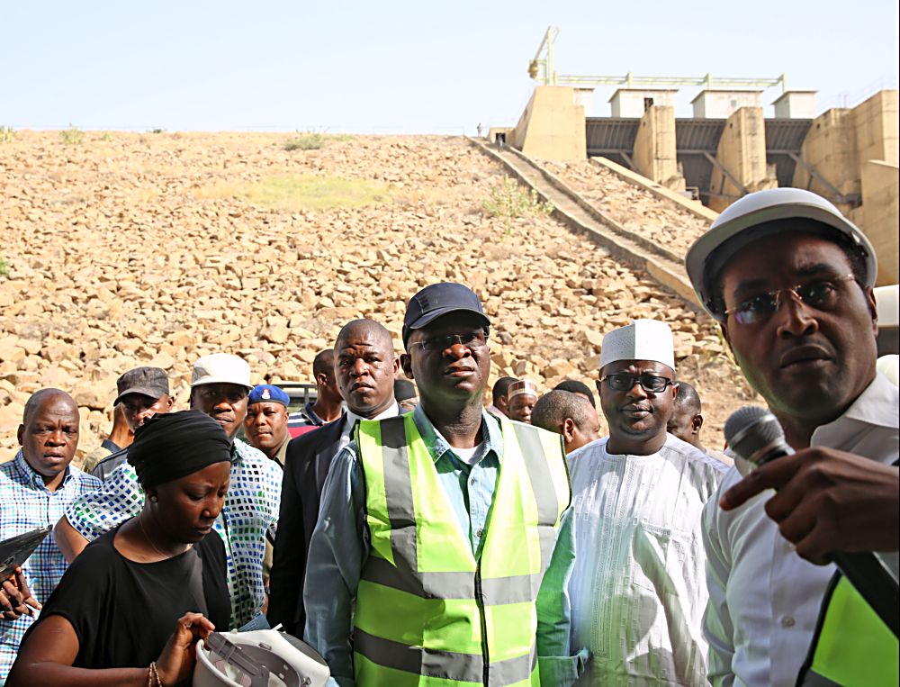 Hon Minister of Power Works  Housing Mr Babatunde Fashola SAN left being conducted round by the  Mabon Representative Mr Christopherright and Commissioner for Works  Infrastrucure Gombe  State Mr Hassan Mohammed2nd right during the HonMinister s inspection tour of the 40MW Hydro Power Plant in Dadin Kowa Gombe State on Day Three of his inspection tour of Highway Projects in the North East Zone on Saturday 18th March 2017