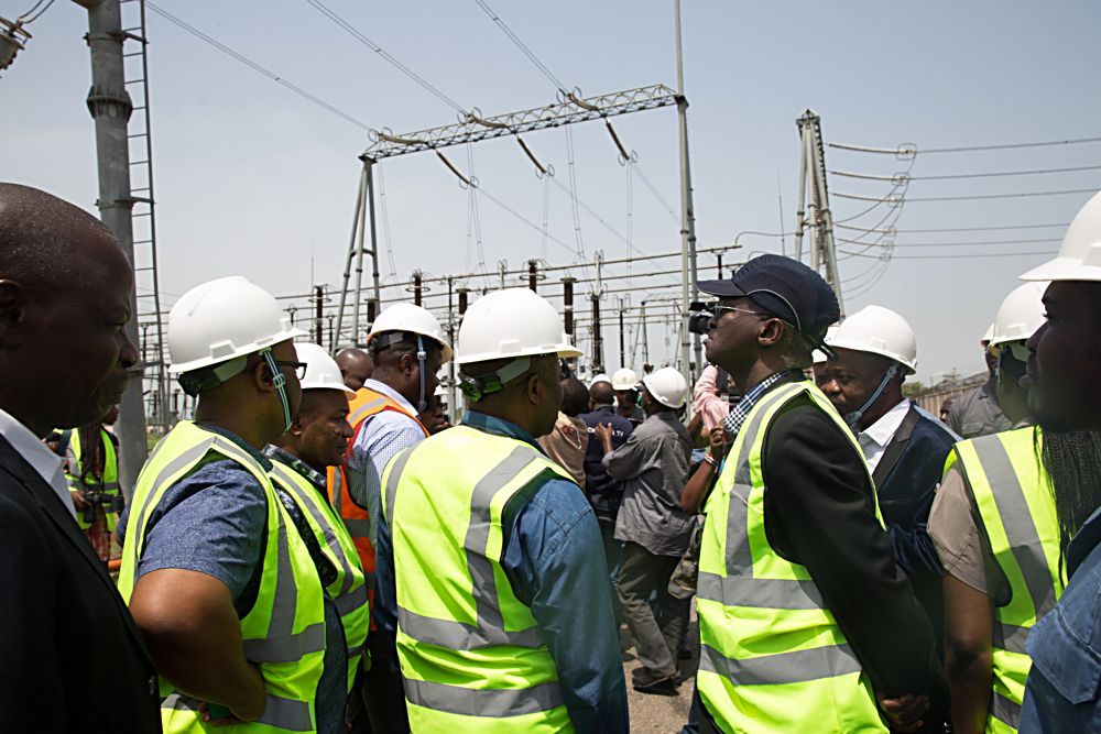 Hon Minister of Power Works  Housing Mr Babatunde Fashola SAN right Governor of Ogun State Sen Ibikunle Amosunmiddle  and others during the HonMinister s inspection tour of the Olorunsogo Power Plant in Ogun State on Day Three  of his inspection tour of Highway Projects in the South West  Zone on Saturday 25th March 2017