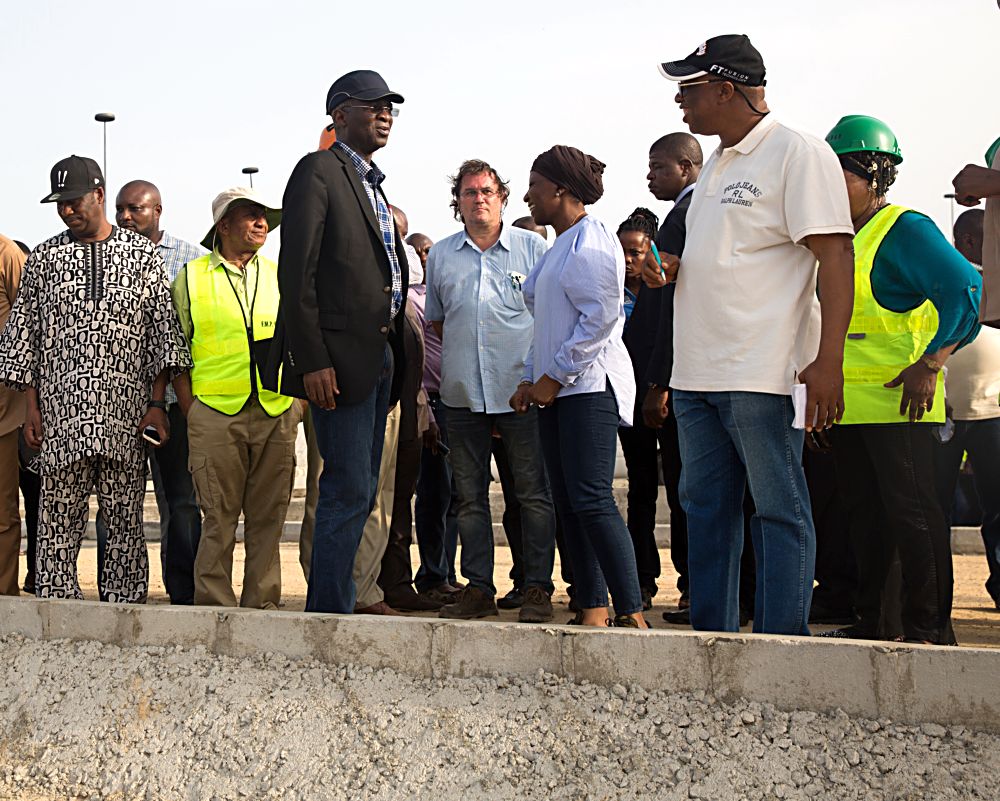 Hon Minister of Power Works  Housing Mr Babatunde FasholaSAN3rd left Director Highways Construction and Rehabilitation Engr Yemi Oguntominiyi and others during the Hon Ministers  inspection tour of the ongoing construction work on the Rehabilitation of Access Road to ApapaTin Can Island Port  NNPC Depot Atlas Cove including the construction of a new bridge running parallel to the existing bridge from Liverpool Roundabout across Port Novo Creek in Lagos State on Day Three of his inspection tour of Highway Projects in the South West Zone of the country on Saturday 25th March 2017