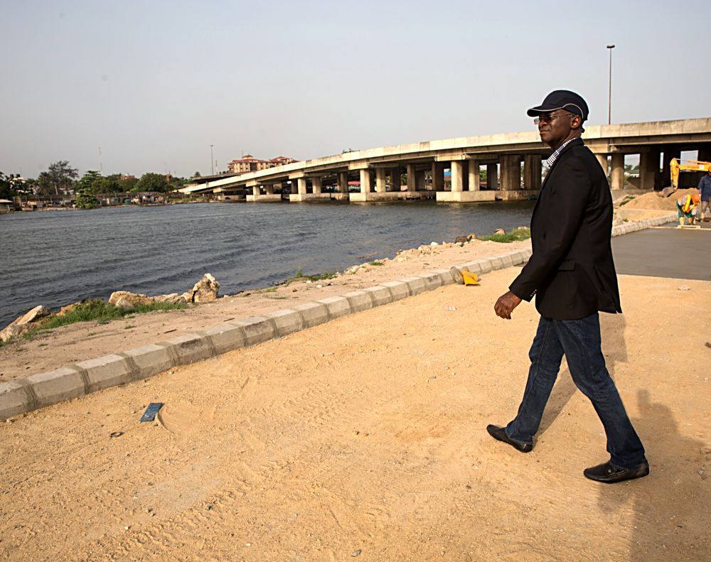 Hon Minister of Power Works  Housing Mr Babatunde FasholaSANleft during his inspection tour of the ongoing construction work on the Rehabilitation of Access Road to ApapaTin Can Island Port  NNPC Depot Atlas Cove including the construction of a new bridge running parallel to the existing bridge from Liverpool Roundabout across Port Novo Creek in Lagos State on Day Three of his inspection tour of Highway Projects in the South West Zone of the country on Saturday 25th March 2017