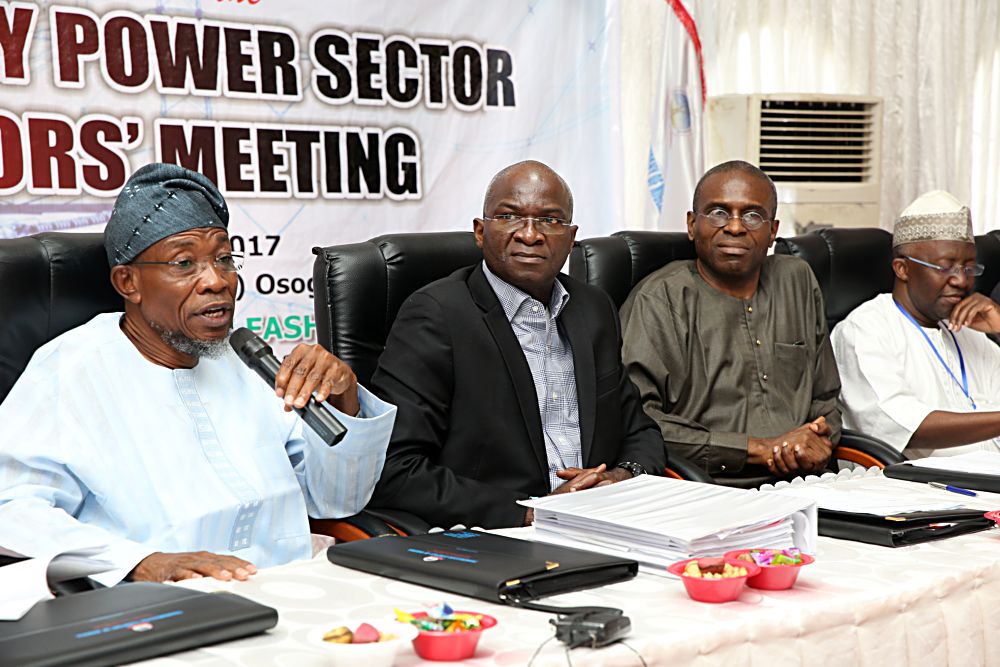 Hon Minister of Power Works  Housing Mr Babatunde Fashola SAN 2nd left Governor State of Osun Ogbeni Rauf Aregbesolaleft Permanent Secretary Power in the Ministry Mr Louis Edozien 2nd right and Vice Chairman Nigerian Electricity Regulatory  CommissionNERC Engr Sanusi Garbaright during the 14th Monthly Meeting with Sectoral Paricipants in the Power Sector hosted by Transmission Company of NigeriaTCN at the National Control Centre NCC Osogbo Osun State on Monday 10th  March 2017