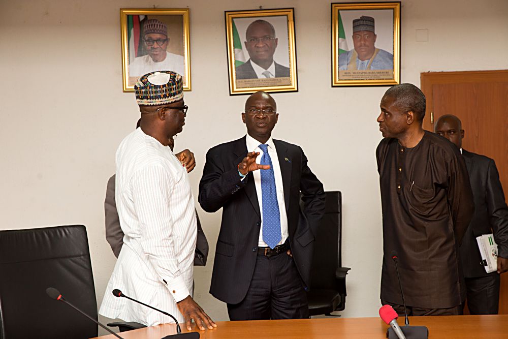 Hon Minister of PowerWorks  Housing Mr Babatunde Fashola SANmiddle Permanent Secretary Power in the Ministry Mr Louis Edozienright and Chief Executive Officer of Afrinergia Power Ltd Mr Matthew Igbalajobi left shortly after the signing ceremony of the PutCall Option Agreement POCA for Afrinergia and CT Cosmos Solar Power Developers by the Federal Government at the Ministry of Power Works and Housing Headquarters Mabushi Abuja on Tuesday 11 April 2017