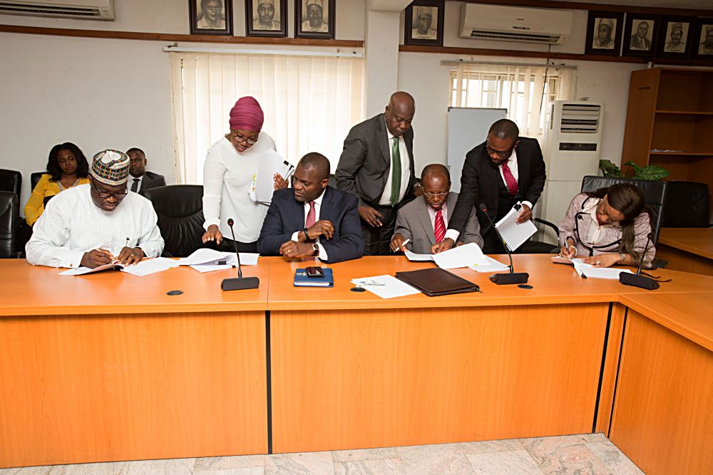 MDCEO Nigerian Bulk Electricity Trading CompanyNBET Mrs Marilyn Amobi right Chief Executive Officer of Afrinergia Power Ltd Mr Matthew Igbalajobi left Chairman Afrinergia Power Ltd  Mr Bestman Uwadia 2nd left Chief Execuive Officer CT Cosmos Mr Henry Opara2nd right during the signing ceremony of the PutCall Option Agreement POCA for Afrinergia and CT Cosmos Solar Power Developers by the Federal Government at the Ministry of Power Works and Housing Headquarters Mabushi Abuja on Tuesday 11 April 2017