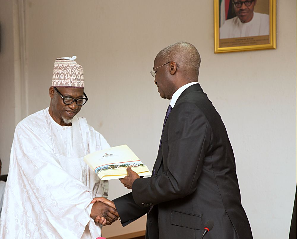 Hon Minister of Power Works  Housing Mr Babatunde Fashola SANright andChairman Board of Rural Electrification AgencyREAEngr Umaru Maza Maza left duringthe inauguration of the Board of Rural Electrification AgencyREAat the Ministry of Power Works  Housing Headquarters Mabushi Abuja on Tuesday 2nd May 2017