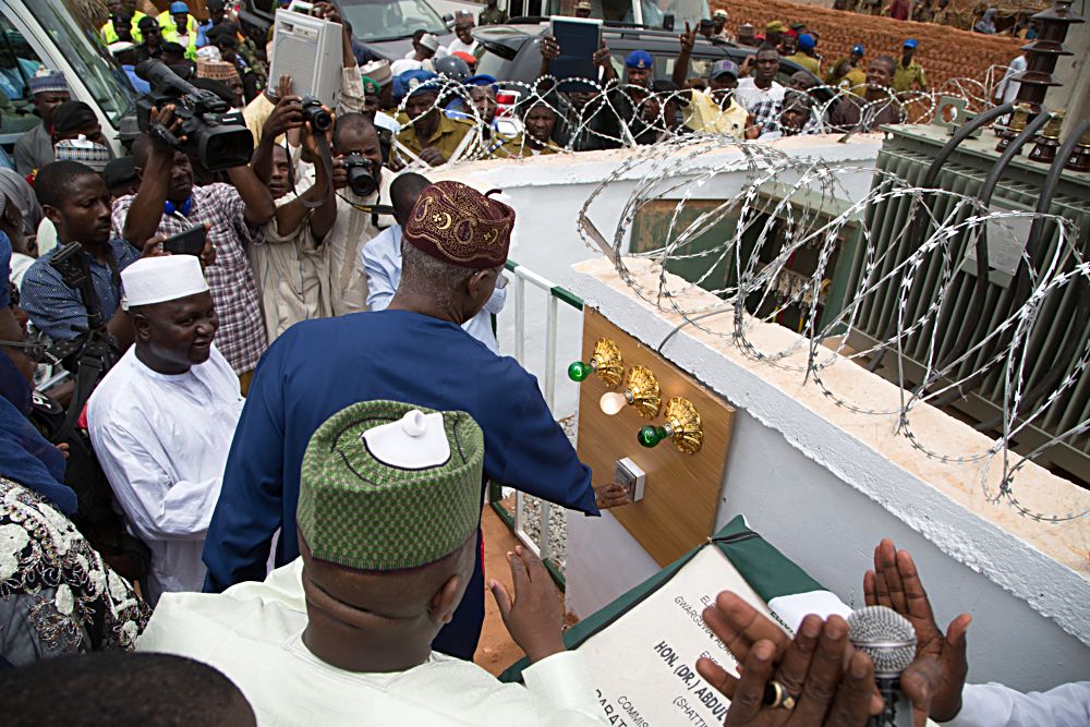 Hon Minister of Power Works  Housing and Special Guest of Honour Mr Babatunde Fashola SANleftGovernor of Zamfara State Dr AbdulAziz Yari Abubakarright and others during the commissioning of Rural Electrification Projects as part of activities to commemorate the 6th Anniversary of Governor Yaris administration inZamfara State on Monday 15th May 2017