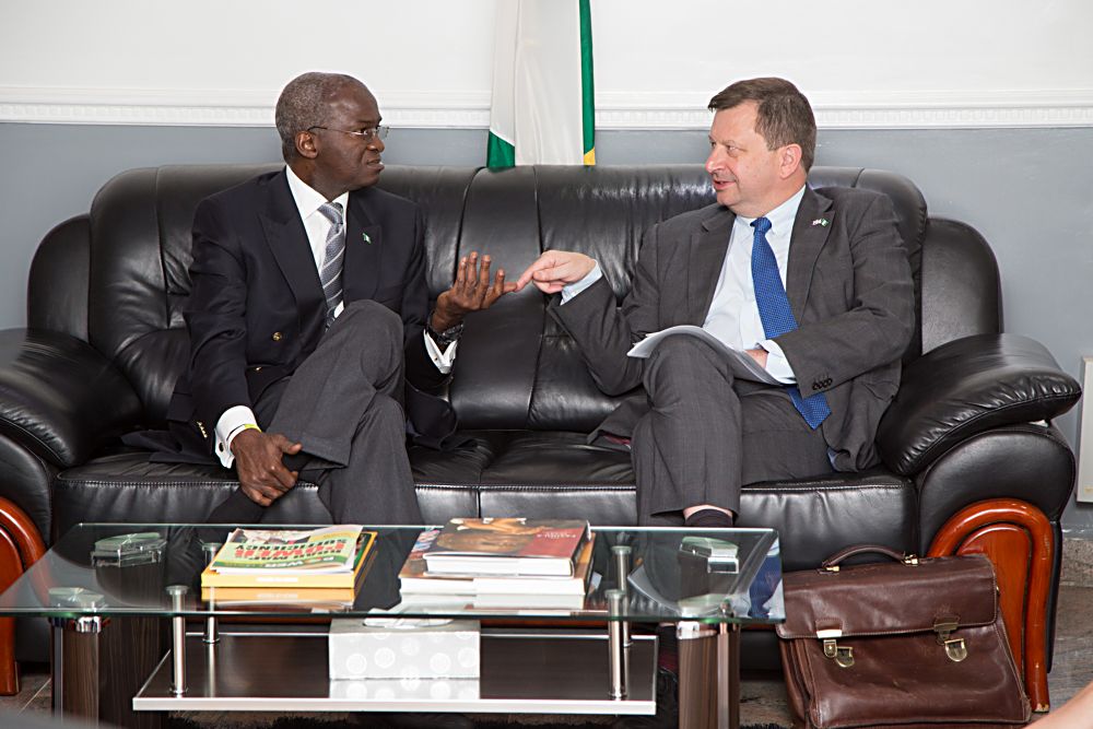 Hon Minister of Power Works  Housing Mr Babatunde Fashola SANleft and the British High Commissioner to Nigeria HE Mr Paul Arkwrightright to discuss issues relating to the development of the nations Power Sector  and Infrastructure with the Hon Minister  at the Ministry of Power Works  Housing Headquarters Mabushi Abuja on Tuesday 16th May 2017