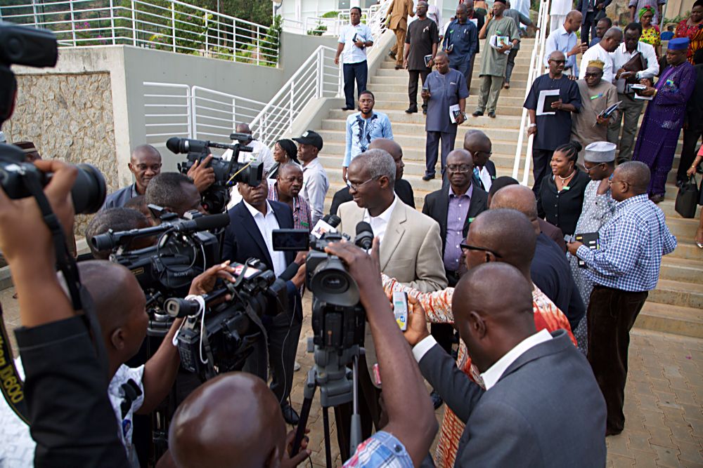 Hon Minister of Power Works  Housing Mr Babatunde Fashola SANright speaking  with Journalists shortly after Day One of the 3Day Retreat for Heads of Departments  Agencies under the Federal Ministry of Power Works  Housing at the Cedar Estate  Abuja on Thursday 18th  May 2017