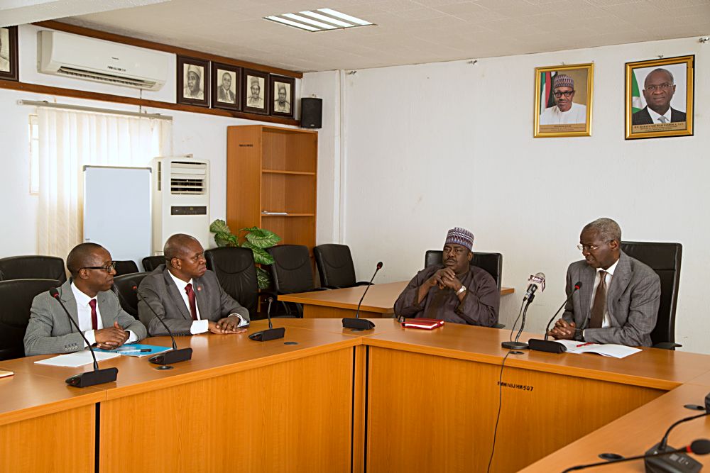 Hon Minister of Power Works  Housing Mr Babatunde Fashola SANrightthe Minister of State in the Ministry Hon Mustapha Baba Shehuri2nd right United Nations Industrial Development OrganisationUNIDO Representative to Ecowas  Regional Director of the Nigeria Regional Office Hub Mr Jean Bakole2nd left and UNIDO National Programme Officer Mr Reuben Bamideleleft  during a courtesy visit to the Hon Minister at the Ministry of Power Works  Housing Headquarters Mabushi Abuja on Monday 22nd May 2017