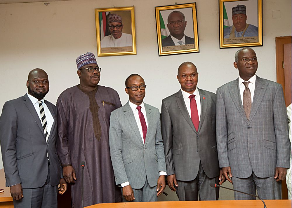 Hon Minister of Power Works  Housing Mr Babatunde Fashola SAN rightthe Minister of State in the Ministry Hon Mustapha Baba Shehuri2nd left United Nations Industrial Development OrganisationUNIDO Representative to Ecowas  Regional Director of the Nigeria Regional Office Hub Mr Jean Bakole2nd right UNIDO National Programme Officer Mr Reuben Bamidelemiddle  and UNIDO Energy Expert Mr Mustapha Alhaji left in a group photograph shortly after the courtesy visit to the Hon Minister at the Ministry of Power Works  Housing Headquarters Mabushi Abuja on Monday 22nd May 2017