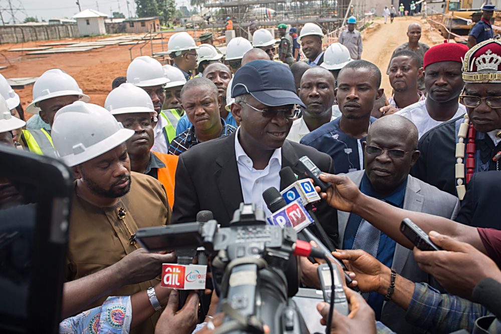 Hon Minister of Power Works  Housing Mr Babatunde Fashola SANmiddleflanked by the Managing DirectorChief Executive Officer Afam Power Plc Engr Olumide Noah Obademi 2nd right Hon Member House of the Rivers State House of Assembly  Promise Chisom Dike left  Deputy to the Paramount Ruler Okolima Ndoki Afam Community Oyigbo LGA Chief Peter Josiah JPright and others as he speaks with journalists shortly after inspecting the various sections and projects within Afam Power Plc in Afam Port Harcourt Rivers State on Thursday 8 June 2017