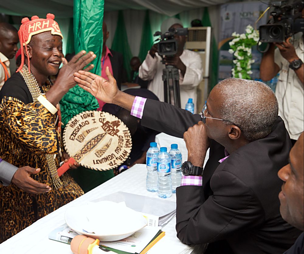 Hon Minister of Power Works  Housing Mr Babatunde Fashola SANright being welcomed by the traditional ruler of the Ugwuaji Community Okado 1 HRH Igwe Christopher Ikenga leftduring the 16th Monthly Meeting with  Sectoral Participants in the Power Sector hosted by the Niger Delta Power Holding Company LimitedNDPHC at the Ugwuaji 330132KV Transmission SubStation Enugu State on Monday 12th  June 2017