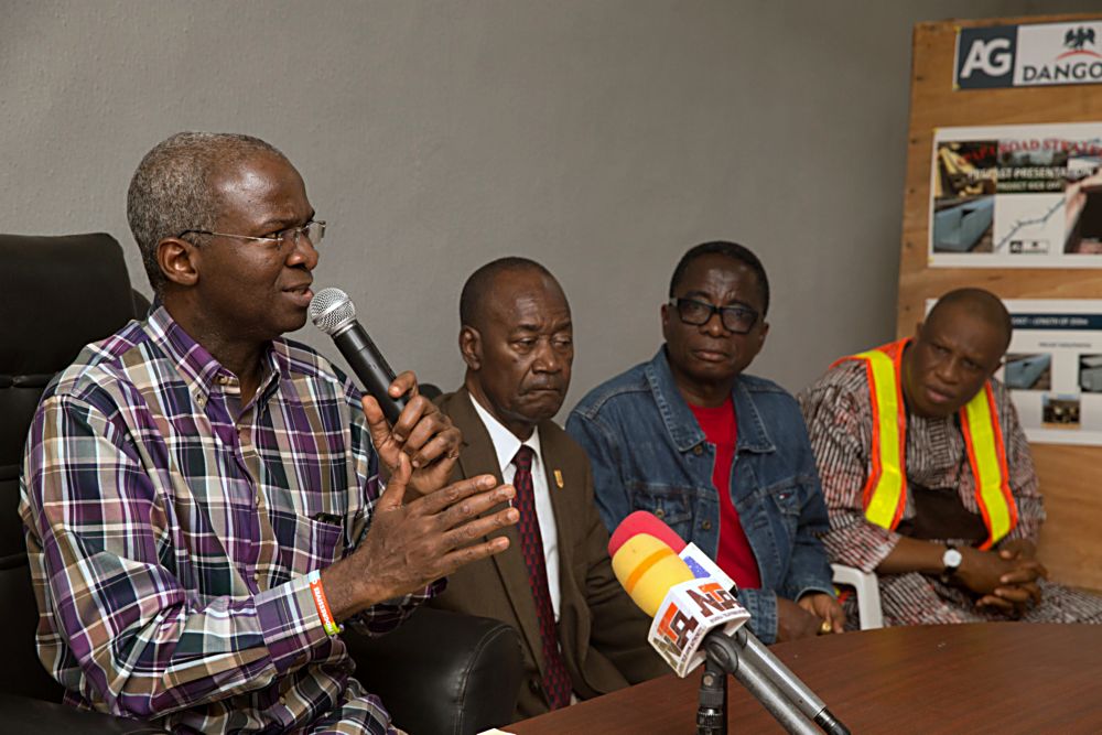 Hon Minister of Power Works  Housing Mr Babatunde Fashola SANleft Director Highways Construction and Rehabilitation Engr Yemi Oguntominiyi right Honorary Adviser to the PresidentChief Executive of the Dangote Group Engr Joseph Makoju2ndleft and Group Managing Director Flour Mills of Nigeria Plc Mr Paul Gbededo2ndrightduring a press briefing on the Kick Off of the Reconstruction of the 2km long Apapa Wharf Dual Carriageway in Lagos State on Saturday 17th June 2017