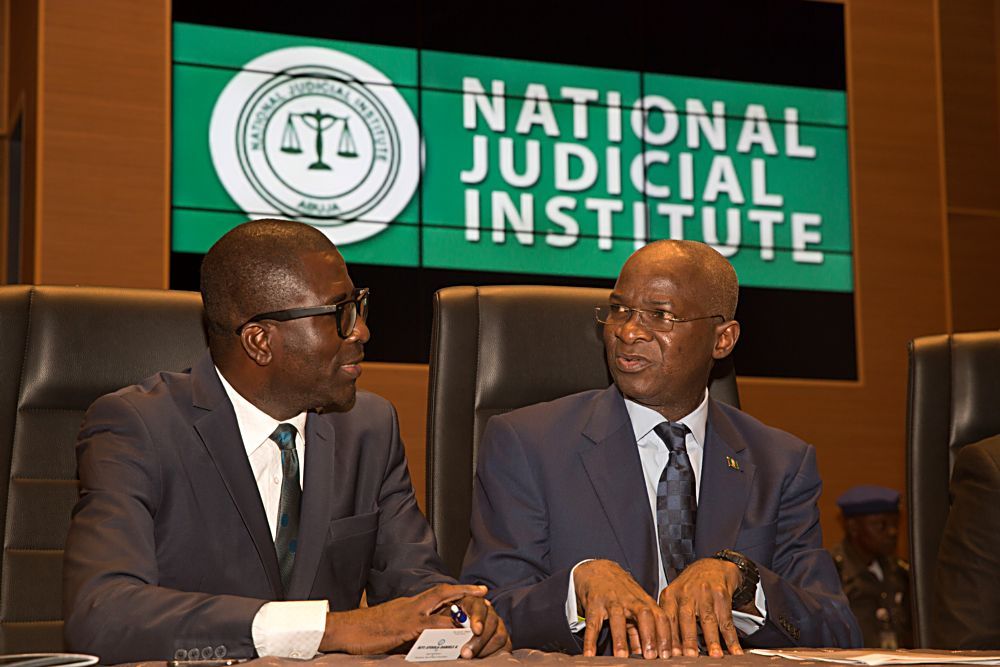 Hon Minister of Power Works  Housing Mr Babatunde Fashola SANright and FounderPresident International Institute for Petroleum Energy Law and PolicyIIPELP Prof Niyi Ayoola  Daniels left during the Opening Ceremony of the 3rdIIPEPNJI Annual Judges Workshop on Petroleum Gas and Power Sectors at the Aloysius Katsina Alu Seminar Block National Judicial Institute Abuja on Monday 19th June 2017