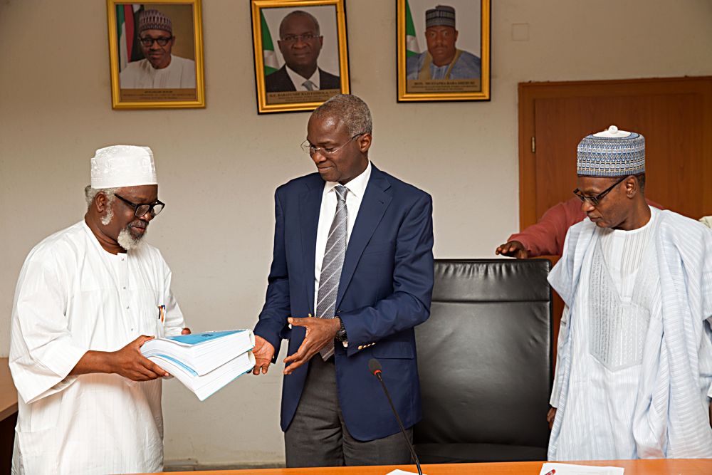 Hon Minister of Power Works  Housing Mr Babatunde Fashola SAN middle Permanent Secretary Works  Housing Mr Muhammed Bukar rightand Chairman Nigeria National Building Code Arc Mohammed Faworaja left during the presentation of the Summary of the 2017 Revised Edition of the National Building Code to the Hon Minister at the Ministry of Power Works  Housing Headquarters Mabushi Abuja on Tuesday 11th July 2017