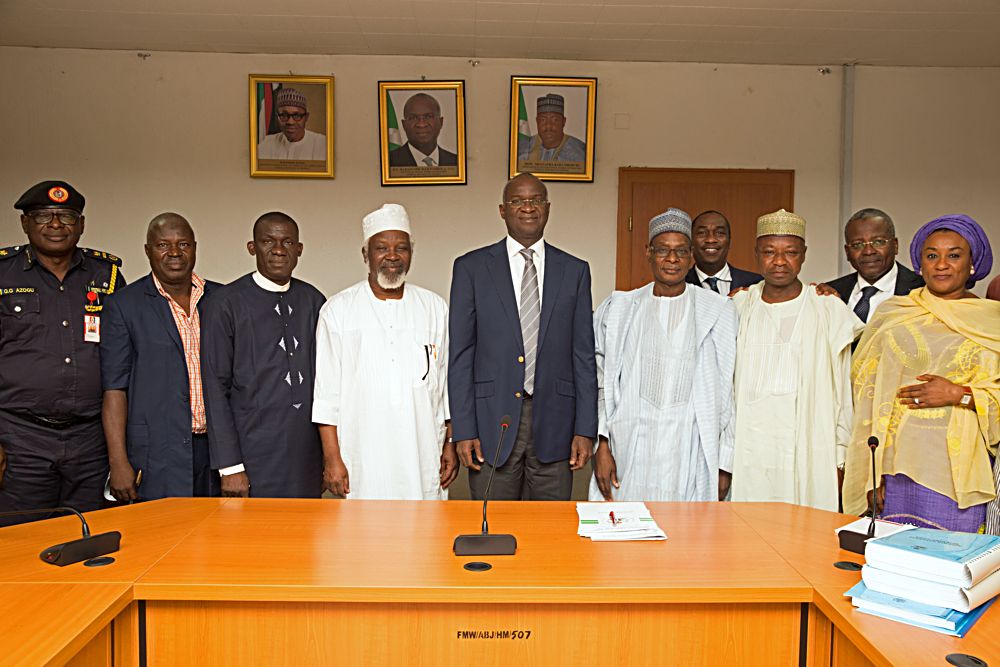 Hon Minister of Power Works  Housing Mr Babatunde FasholaSANmiddle Permanent Secretary Works  Housing Mr Muhammed Bukar4thright Director and HOD Public Building and Housing Development Department Arc Sani Gidado 3rdright Director of Finance Mr Ibrahim Tumsah2ndrightDirector in the Ministry Mrs Salma MohammedrightChairman Nigeria National Building Code Arc Mohammed Faworaja 4thleftand others in a group photograph shortly after the presentation of the Summary of the 2017 Revised Edition of the National Building Code to the Hon Minister at the Ministry of Power Works  Housing Headquarters Mabushi Abuja on Tuesday 11th July 2017