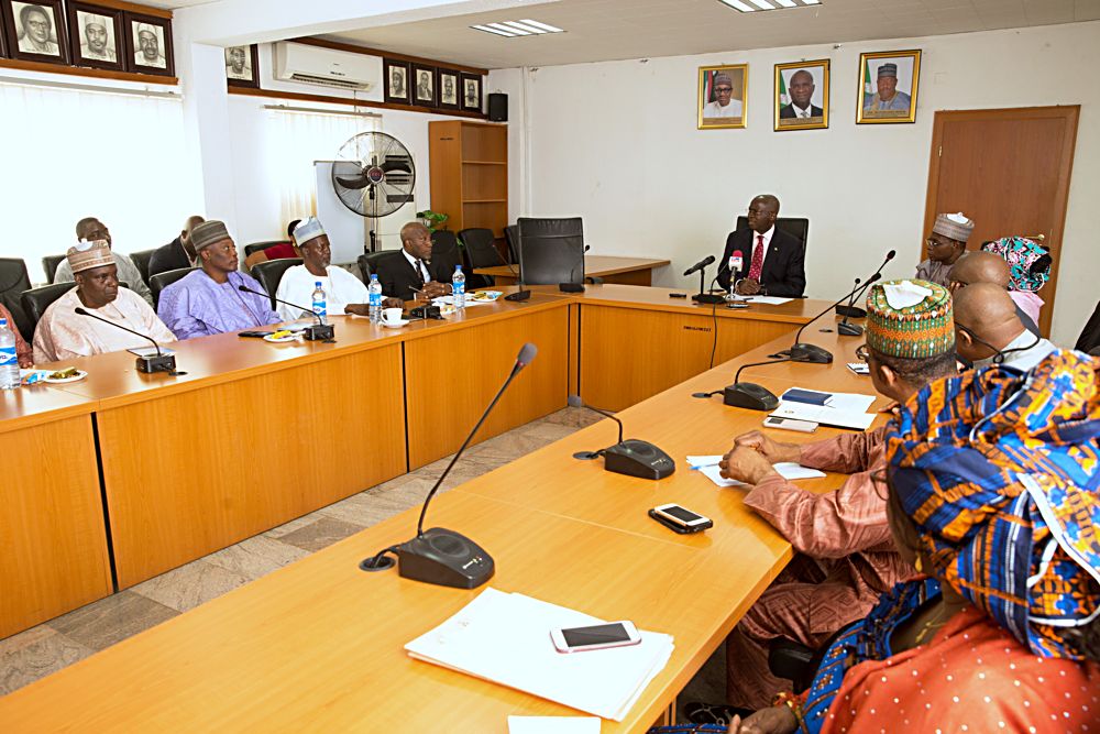 Hon Minister of Power Works  Housing Mr Babatunde Fashola SAN right Chairman Council of Registered Builders of Nigeria CORBONProf Kabir Bala4th left  and others during the  inauguration of the Council of Registered Builders of NigeriaCORBON at the Ministry of Power Works Housing Headquarters Mabushi Abuja on Tuesday 18th July 2017