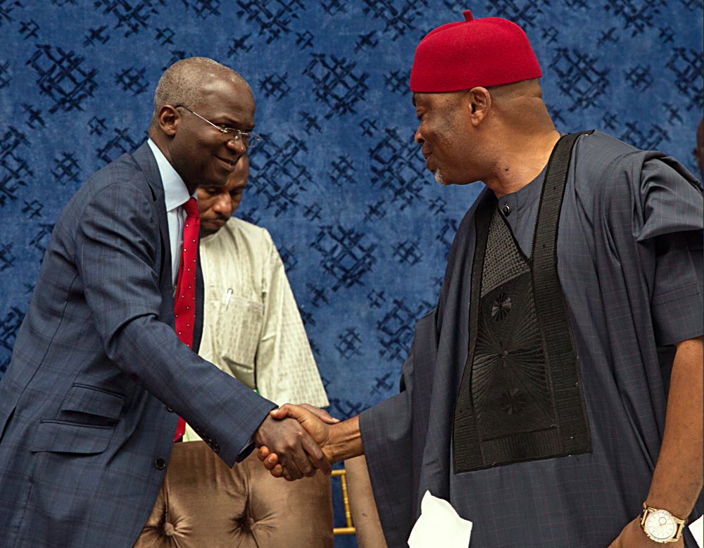 Hon Minister of Power Works  Housing Mr Babatunde Fashola SANleft and Chairman  House Committe on Works Hon Toby Okechukwuright duringthe 23rdMeeting of the National Council on Works with the theme Adequate Traffic Signage An Essential Key for Highways Infrastructure Safety and Comfort hosted by the Federal Ministry of Power Works and Housing at the NAF Conference Centre Ahmadu Bello Way Kado District Abuja on Thursday 20thJuly 2017