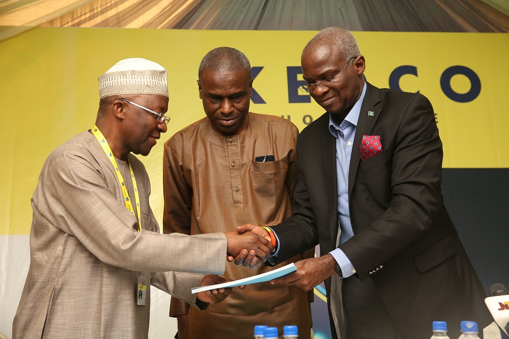 Hon Minister of Power Works  Housing Mr Babatunde Fashola SAN right receives a copy of the MiniGrid Regulation from Vice Chairman Nigerian Electricity Regulatory Commission Mr Sanusi Garba left while the Permanent Secretary Power Engnr Louis Edozien middle looks on during the 18th Monthly Meeting with Sectoral Partcipants in the Power Sector hosted by the Kano Electricity Distribution Company KEDCO at the Kombotso Transmission Station Kano Kano State on Monday 14th August 2017