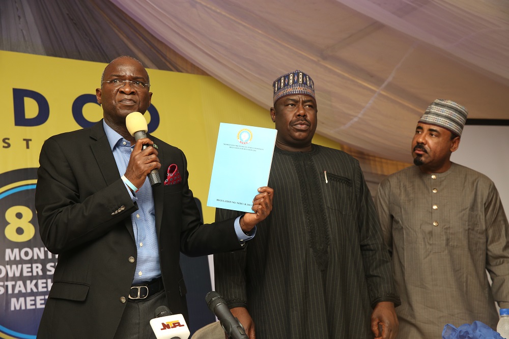 Hon Minister of Power Works  Housing Mr Babatunde Fashola SAN left presenting the MiniGrid Regulation with Minister of State Hon Mustapha Baba Shehuri middle and Managing Director Kano Electricity Distribution Company Dr Jamil Isyaku Gwamna right during the 18th Monthly Meeting with Sectoral Partcipants in the Power Sector hosted by the Kano Electricity Distribution Company KEDCO at the Kombotso Transmission Station Kano Kano State on Monday 14th August 2017