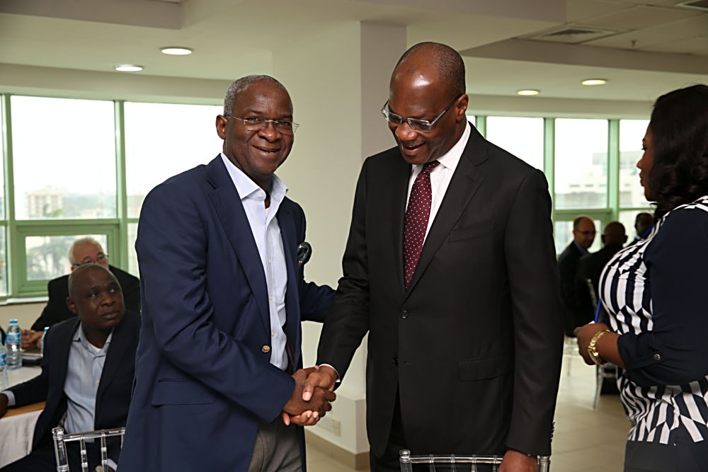 Hon Minister of Power Works  Housing Mr Babatunde Fashola SAN left and Chairman KPMG West Africa Mr Kunle Elebute right during the Nigeria Industrial Policy and Competitiveness Advisory Councils Critical Infrastructure Stakeholder Session on Power Road  Broadband at the KPMG Tower Victoria Island Lagos on Thursday 17th August 2017