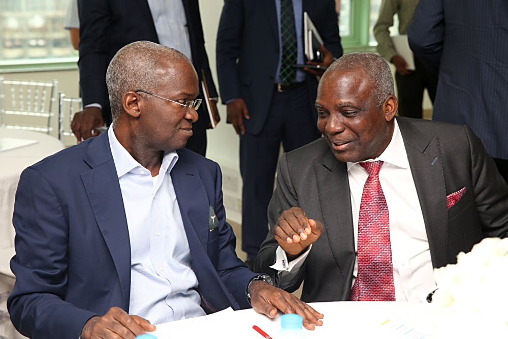 Hon Minister of Power Works  Housing Mr Babatunde Fashola SAN left and former Minister of Power Prof Barth Nnaji right during the Nigeria Industrial Policy and Competitiveness Advisory Councils Critical Infrastructure Stakeholder Session on Power Road  Broadband at the KPMG Tower  Victoria Island Lagos on Thursday 17th August 2017