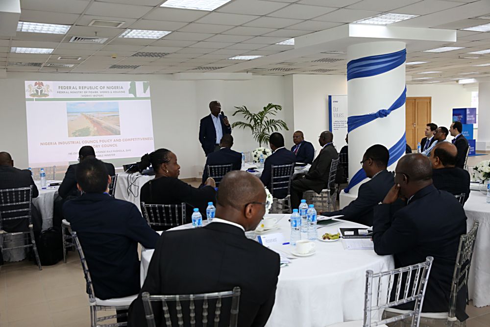 Hon Minister of Power Works  Housing Mr Babatunde Fashola SAN rightmaking a presentation on the Works Sectorduring the Nigeria Industrial Policy and Competitiveness Advisory Councils Critical Infrastructure Stakeholder Session on Power Road  Broadband at the KPMG Tower  Victoria Island Lagos on Thursday 17thAugust 2017