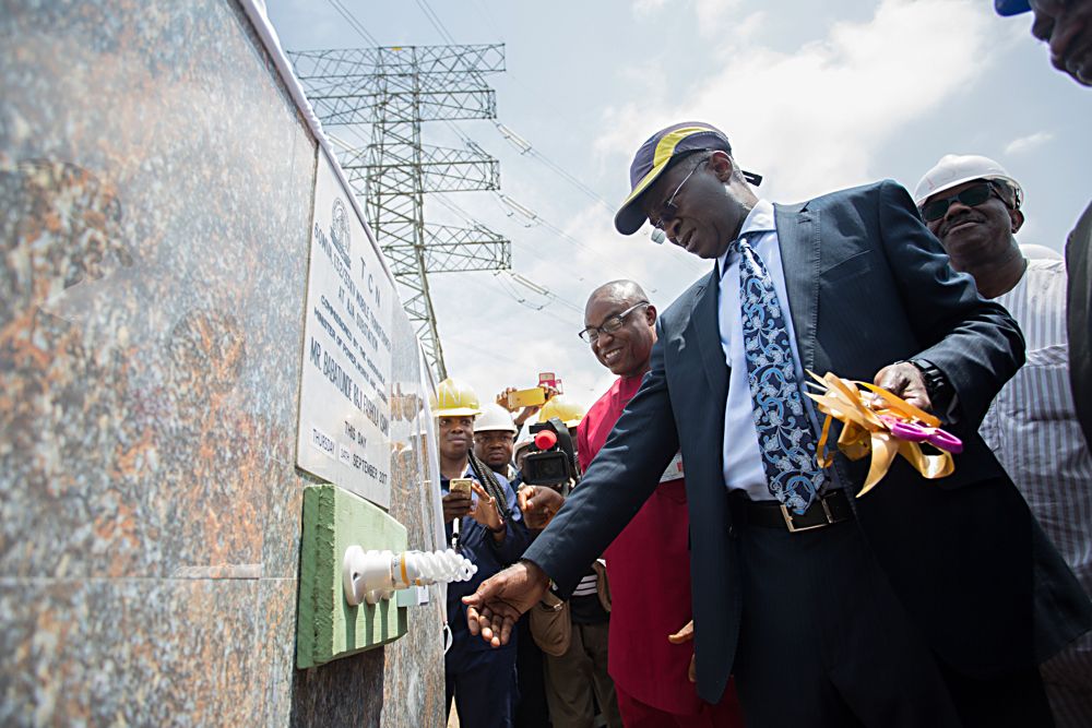 HonMinister of Power Works  HousingMr Babatunde FasholaSANrightGeneral Manager Transmission Lagos Region Engr Goeffrey Nwokoyeleft and othersduring the commissioning of the 60MVA 13233KV Mobile Transformer installed by the Transmission Company of Nigeria to increasetransformer availablecapacity at the Aja Substation in Eti Osa Lagos on Thursday 14th September 2017