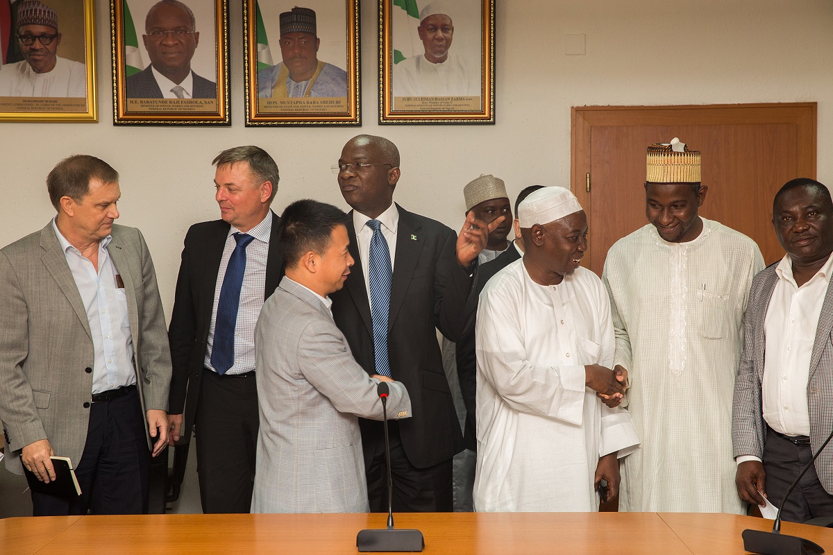 Hon Minister of Power Works  HousingMr Babatunde FasholaSAN3rd left  Minister of State Surv Suleiman Zarma Hassan 3rd rightManaging DirectorCEO Julius Berger Nigeria Plc Mr Wolfgang Goetsch2nd left and other representatives of construction firms in a group photograph shortly after  a meeting with the Contractors for a  Progress Report on Road Projects Across the country at the Ministry of Power Works  Housing Headquarters Mabushi Abuja on Tuesday 19th September 2017 