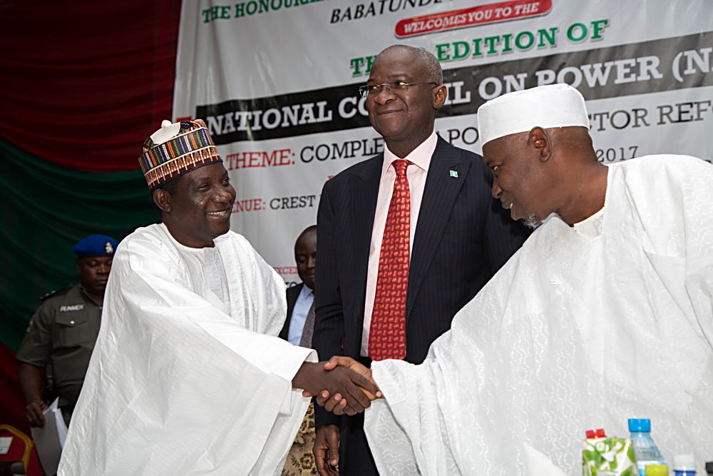 Hon Minister of Power Works  Housing Mr Babatunde Fashola SANmiddle Minister of State Surv Suleiman Zarma Hassan right and Governor of Plateau State Barr Simon Bako Lalongleft during the Executive Session of the 3rd National Council on PowerNACOP with the theme Completing Power Sector Reforms at the Crest Hotel  Gardens Old Airport Road Jos Plateau State on Thursday 21st September 2017