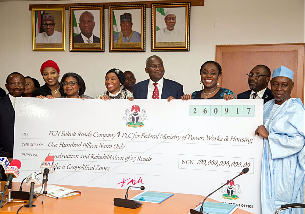 Hon Minister of Power Works  HousingMr Babatunde FasholaSAN4th rightMinister of Finance Mrs Kemi Adeosun3th right Minister of State Surv Suleiman Zarma Hassanright  Managing DirectorLotus Capital Mrs Hajara Adeola4th MDCEO STL Trustess Mrs Funmi Ekundayo2nd left Deputy CEO FBN Merchant Bank Mr Taiwo Okeowoleft and Director GeneralDebt Management Office Mrs Patience Oniha3rd leftduring the presentation of the cheque of the N100Billion Sukuk Issuance Proceed by the Minister of Finance to the Minister of PowerWorks and Housingat the Ministrys Headquarters Mabushi Abuja on Thursday 5thOctober 2017