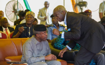 Vice President Prof YemiOshinbajo SANleft and Minister of Power Works  Housing Mr Babatunde Fashola SANright during the Flag Off Ceremony for Construction of Bonny  Bodo Road Rivers State on Thursday 12th October 2017