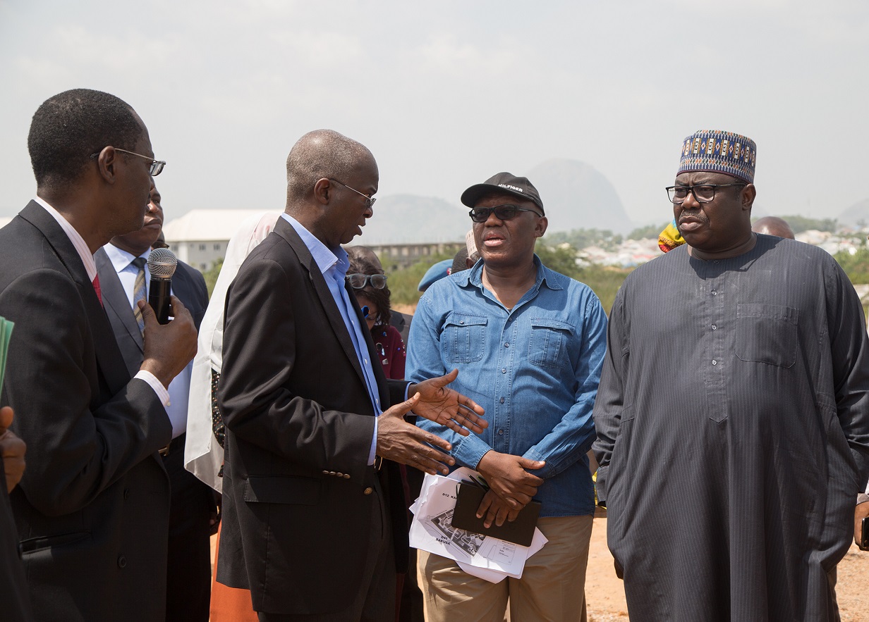 Hon Minister of Power Works  Housing Mr Babatunde Fashola SAN 2nd left Minister of State Hon Mustapha Baba Shehuri right Managing Director Federal Mortgage Bank of Nigeria FMBN Arc Ahmed Dangiwa left and Executive Director Associated Design Consultants Mr Uche Ezenwaka 2nd right during the inspection of the FMBN Goodluck Jonathan Legacy City Housing Project in Kara District Abuja 