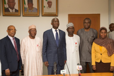 Hon Minister of Power Works  Housing Mr Babatunde Fashola SAN3rd left Permanent Secretary Power Engr Louis Edozien 2nd right Vice Chairman Nigerian Electricity Regulatory Commission Mr Sanusi Garba2nd left and others in a group photographshortly after the presentation of the Eligible Customers Regulations 2017to the Hon Minister at the Ministry of Power Works  Housing Headquarters Mabushi Abuja on Monday 6th November 2017