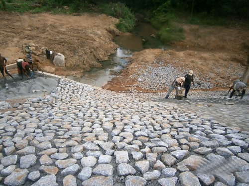 Personnel of the Reynolds Construction Company Nigeria Limited working onthe Stone Pitchingat the Reconstruction and Asphalt overlay of Benin OfosuOreAjebandeleShagamu Dual Carriageway Phase IV Ajebandele Shagamuas captured in the monthly progress report directed during the recent meeting of the HonMinister of PowerWorks and Housing Mr Babatunde Fashola SAN with contractors handling major projects across the country