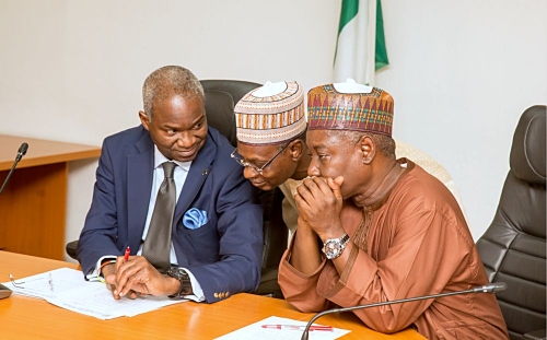 Hon Minister of Power Works  Housing Mr Babatunde FasholaSANleft Minister of StateSurv Suleiman Zarma HassanrightandPermanent SecretaryWorks  Housing Mr Mohammed Bukarmiddleduring the Meeting with Stakeholders of the Bodo  Bonny Road and Bridges Project at the Ministry of PowerWorks  Housing HeadquartersMabushiAbuja on Thursday 22nd February 2018