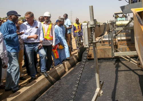 Hon Minister of Power Works  Housing Mr Babatunde FasholaSANleftand Managing Director Dantata  Sawoe Nigeria Limited Mr Udo Heidschuster2nd rightduring the Hon Ministers inspection of the ongoing dualization of Kano Western by Pass in Kano State being part of Highway Projects in the North West Zone on Sunday 11th March 2018