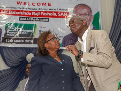 Hon Minister of PowerWorks  Housing Mr Babatunde FasholaSANright andHead of ServiceAkwa Ibom State Mrs Ekerebong Akpanleftduring the 25thMonthly Meeting of Operators in the Power Sector hosted by the Akwa Ibom State Government and Ibom Power at the Ibom Hall IBB Way Uyo Akwa Ibom State on Monday 12th March 2018