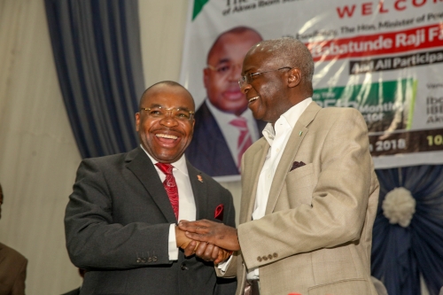 Hon Minister of PowerWorks  Housing Mr Babatunde FasholaSANright andGovernor of Akwa Ibom State Mr Udom Emmanuelleftduring the 25thMonthly Meeting of Operators in the Power Sector hosted by the Akwa Ibom State Government and Ibom Power at the Ibom Hall IBB Way Uyo Akwa Ibom State on Monday 12th March 2018