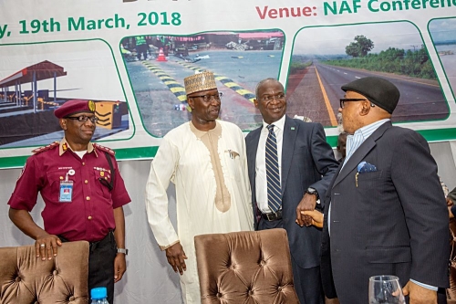 Representative of the President  Secretary to the Federal Government Mr Boss Gida Mustapha 2nd leftHon Minister of Power Works  Housing Mr Babatunde Fashola SAN2nd rightHonMinister of Labour and Employment Dr Chris Ngigeright and the Corps Marshal Federal Road Safety Corps Dr Boboye Oyeyemi leftduring the Opening Session of the One  Day Public Enlightenment on Developmentsin the Road Sectororganized by the Ministry of Power Works and Housingat the Nigeria Air Force Conference Centre Abuja on Monday 19th March 2018