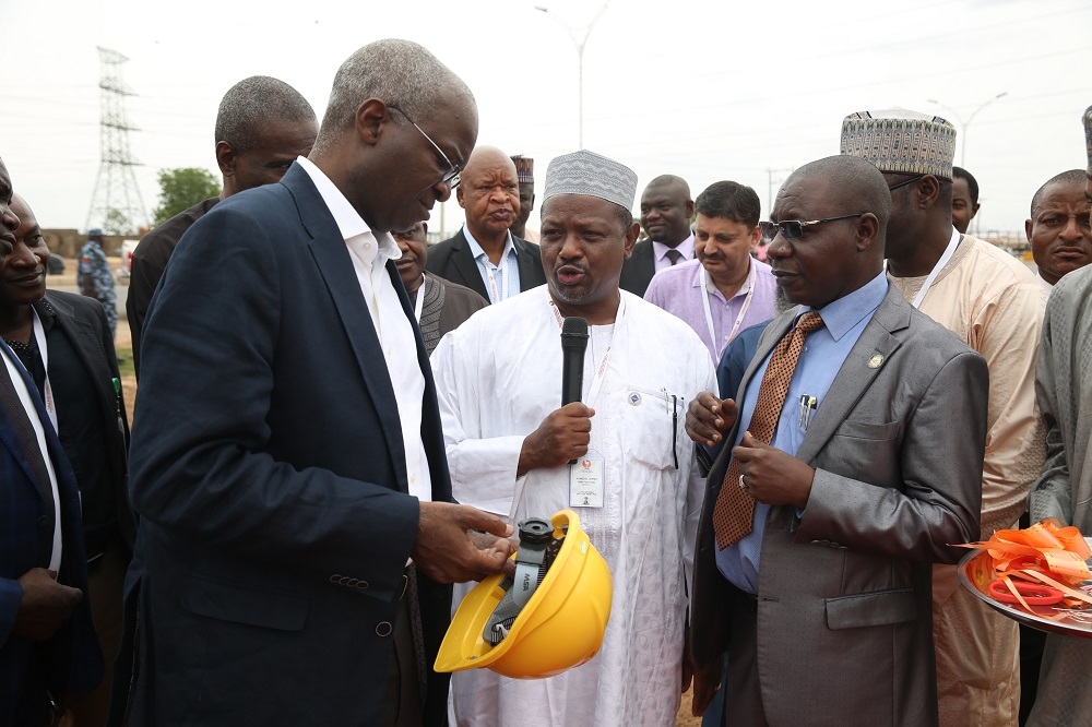 Hon Minister of Power Works  Housing Mr Babatunde FasholaSANleftManaging DirectorYola Electricity Distribution CompanyYEDCEngr Baba Umara Mustapha leftand Managing DirectorCEO Faro Table Water Mr Ahmed Jarmamiddleduring the commissioning of 33KV Industrial Feeder to Kofare Industrial Area Jimeta shortly before the 27th Meeting with Operators in the Power Sector hosted by the Yola Electricity Distribution CompanyYEDC at the TCN Transmission Station along Numan Road Jimeta Adamawa State on Monday 14th May 2018