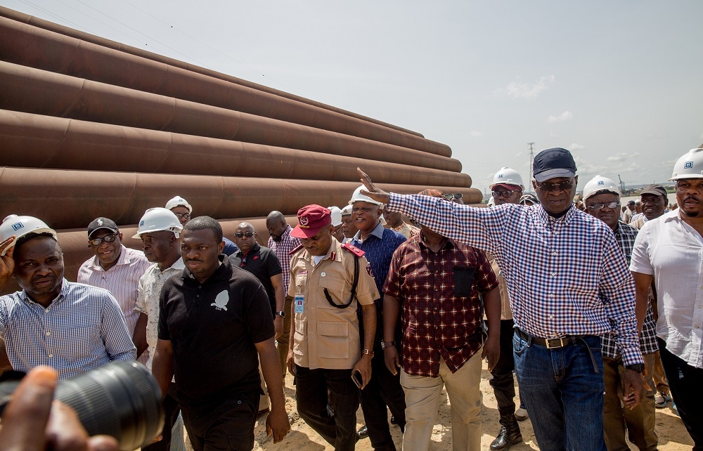 Hon Minister of Power Works  Housing Mr Babatunde FasholaSAN right and othersduring the Hon Ministersinspection tour of the ongoing construction work on 2nd Niger Bridge in Anambra and Delta States on Day Three of his inspection tour of Federal Government Infrastructure Projects in the South East Zone of the country on Thursday 19th May 2018