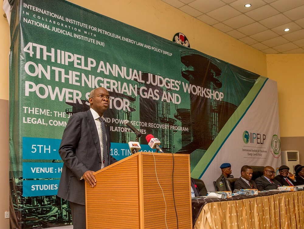 Hon Minister of Power Works  Housing Mr Babatunde Fashola SANleft presenting his Goodwill Message duringthe Opening Ceremony of the 4thIIPEPNJI Annual Judges Workshop on Petroleum Gas and Power Sectors with the theme The Judiciary and Power Sector Recovery Programme  Legal Commercial and Regulatory Issues at the Aloysisus Katsina Alu Seminar Hall National Judicial Institute on Tuesday 5th June 2018