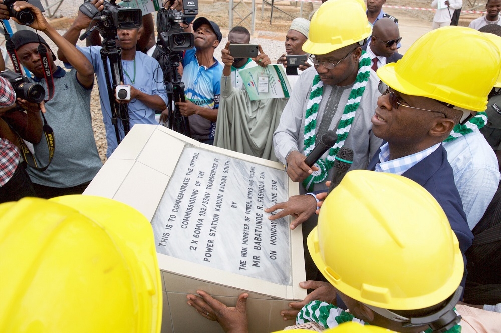 Hon Minister of Power Works  Housing Mr Babatunde FasholaSANmiddleManaging Director CEO Transmission Company of Nigeria Mr Usman Gur Mohammedright and representative of the Governor of Kaduna State  Permanent Secretary of the Ministry of Rural and Community DevelopmentMallam Mahmud Zailanileftduring the commissioning of the 2 x 60MVA 132 33kv Transformers at the Power Station Kakuri Kaduna State on Monday 11th June 2018