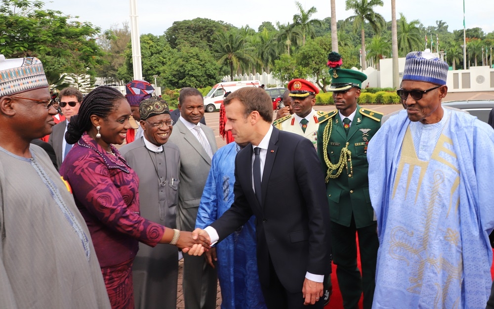 Left to Right Minister of State For Environment Alhaji Ibrahim Jibrin left Minister of Finance Mrs Kemi Adeosun Minister of Information Alhaji Lai MohammedAttorney General andMinister of Justice Mr Abubakar Malami the visiting President Emmanuel Macron of France and President Muhammadu Buhariduring Macrons arrival at the State House Abuja on Tuesday 3rd July 2018