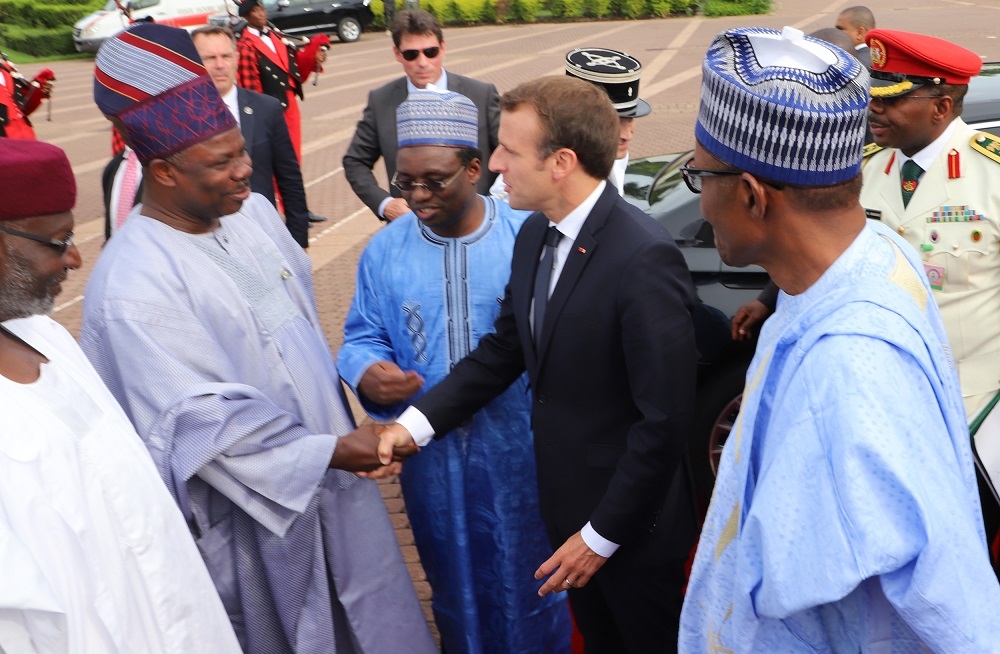 Left to Right Chief of Staff to the President Mallam Abba Kyari left Governor Ibikunle Amosun of Ogun State the visiting President Emmanuel Macron of France and President Muhammadu Buhariduring Macrons arrival at the State House Abuja on Tuesday 3rd July 2018