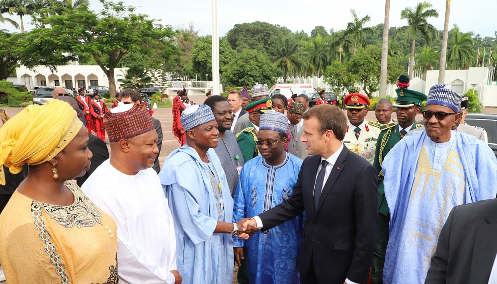 Left to Right Senior Special Assistant on Foreign Affairs and Diaspora to the President Mrs Abike DabiriErewa Permanent Secretary State House Mr Jalal ArabiSenior Special Assistant onMedia and Publicity to the President Mallam Garba Shehu President Emmanuel Macron of France and President Muhammadu Buhariduring Macrons arrival at the State House Abuja on Tuesday 3rd July 2018